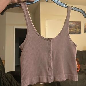 Pink cropped tank top, buttons down front. Stretchy Material, fits like a small.